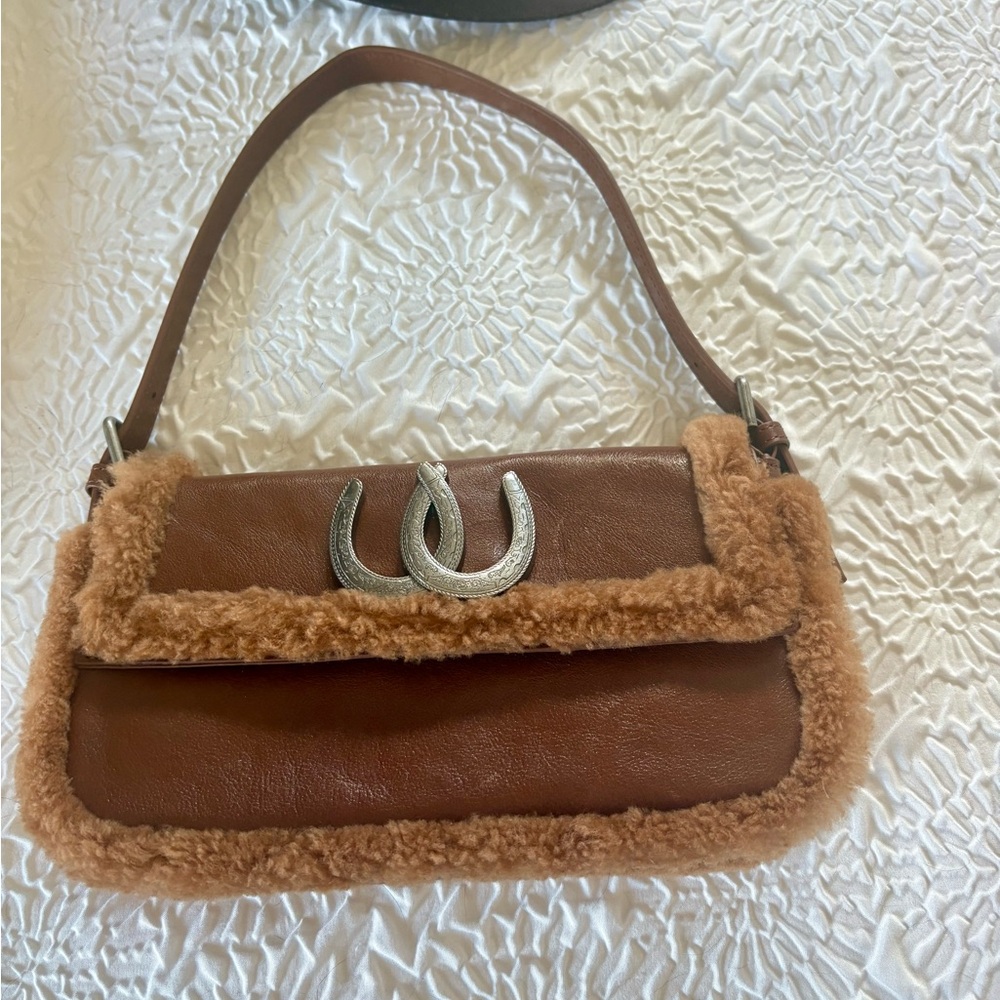 Cowgirl Understated Leather brand  Horseshoe bag